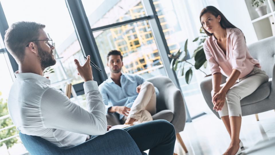 Emotionally Focused Therapy (EFT) is a well-established, evidence-based approach to couples therapy that focuses on fostering secure emotional bonds between partners. Developed by psychologist Dr. Sue Johnson in the 1980s, EFT recognizes that humans have an innate need for emotional connection and attachment. Central to EFT is the belief that distressed couples often struggle due to underlying feelings of insecurity, fear, or vulnerability. Through a collaborative and structured process, therapists help couples identify these underlying emotions and become more aware of their individual patterns of communication and interaction. By providing a safe environment for open expression of emotions and working towards building stronger emotional connections, EFT aims to restore trust and intimacy within relationships. The success of EFT has been substantiated by numerous research studies, highlighting its efficacy in resolving relationship distress and promoting healthier functioning in couples.